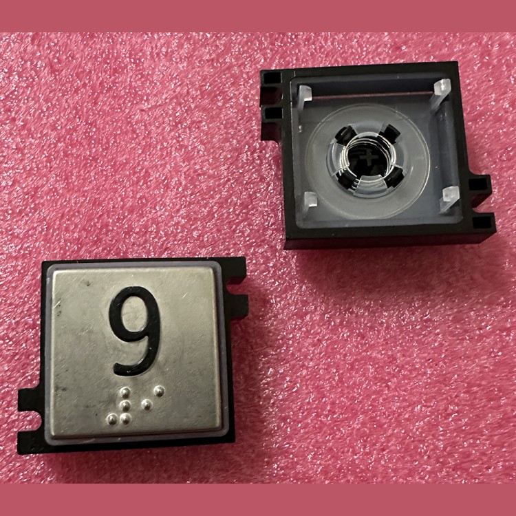 Толкатель кнопки с выдавленной надписью "9" шрифт Брайля Schindler