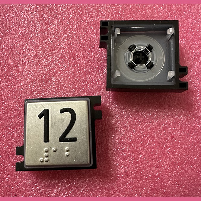 Толкатель кнопки с выдавленной надписью "12" шрифт Брайля Schindler