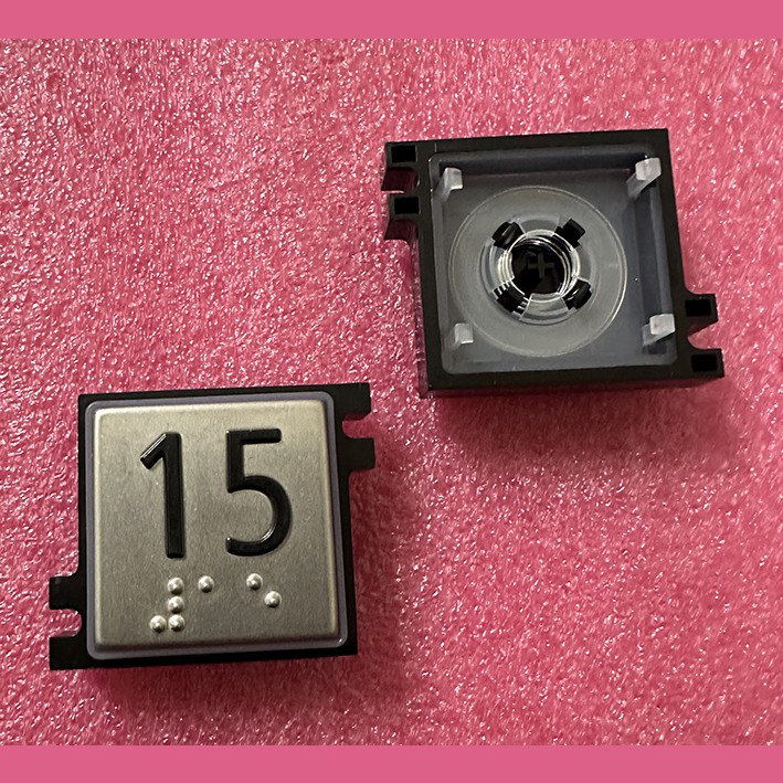 Толкатель кнопки с выдавленной надписью "15" шрифт Брайля Schindler